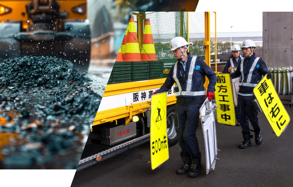 工事現場で作業員が安全標識を設置し、道路補修作業の準備を進める様子
